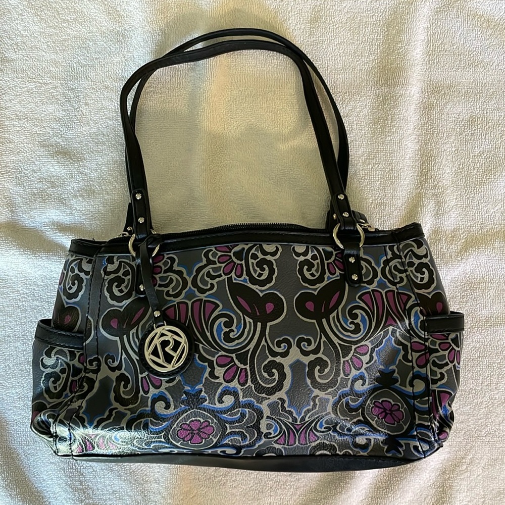 A new w/o tags Relic purse in black & gray with purple & blue accents.